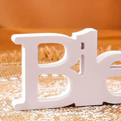 White letter 'B' on a textured surface with an orange background