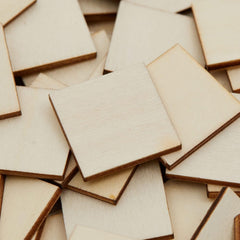 Stack of wooden square tiles with brown edges