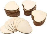 Stacks of heart-shaped wooden cutouts on a white background
