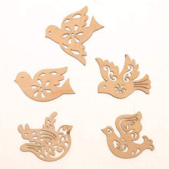 Set of five wooden dove-shaped cutouts on a white background