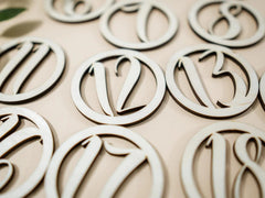 Wooden letters spelling 'LOVE' on a beige background
