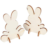 Two wooden bunny shapes on a white background