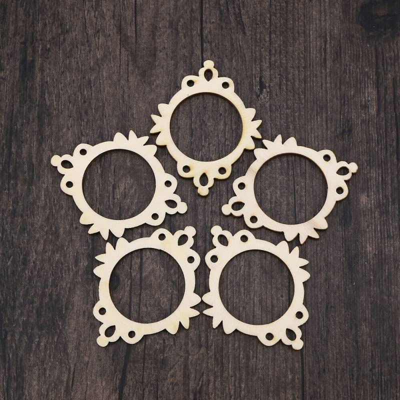 Five decorative beige frames on a dark wooden surface