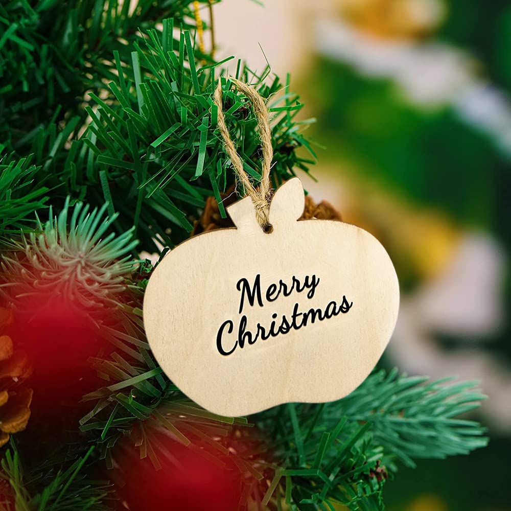 Wooden 'Merry Christmas' ornament hanging on a Christmas tree.