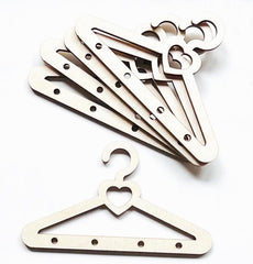 Set of wooden hangers with decorative heart and moon designs on a white background