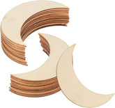 Stack of crescent moon-shaped wooden cutouts on a white background