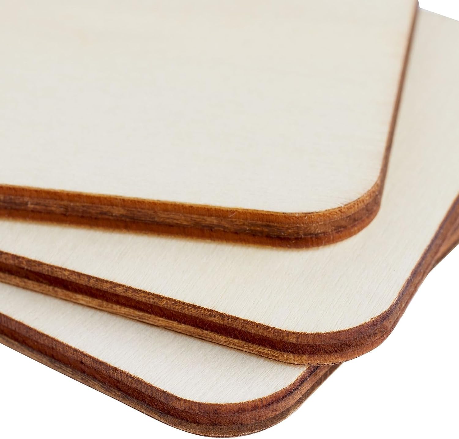 Stack of wooden cutting boards with a white background