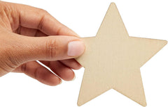 Hand holding a beige star-shaped object against a white background
