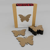 Butterfly-shaped objects in front of a cardboard box with a butterfly design on a gray background