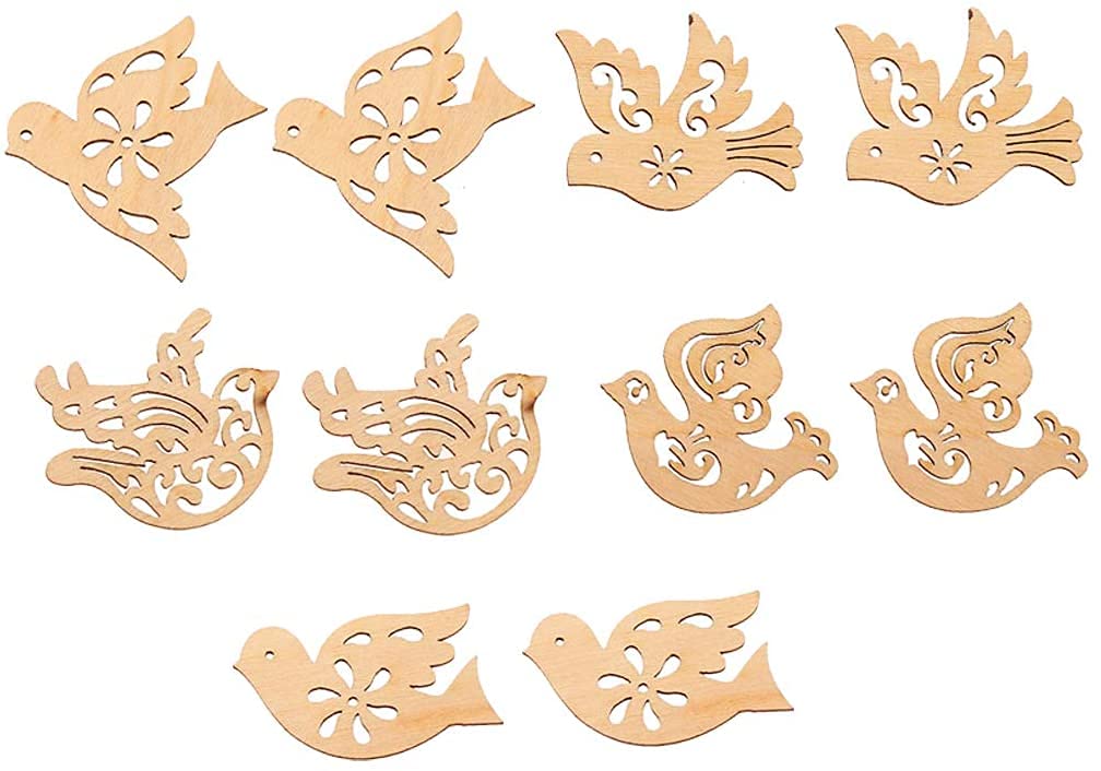 Wooden dove-shaped cutouts with intricate designs on a white background