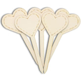 Set of heart-shaped wooden picks on a white background