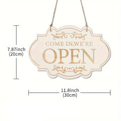 Decorative sign with 'Come in, we're open' text and measurements on a white background