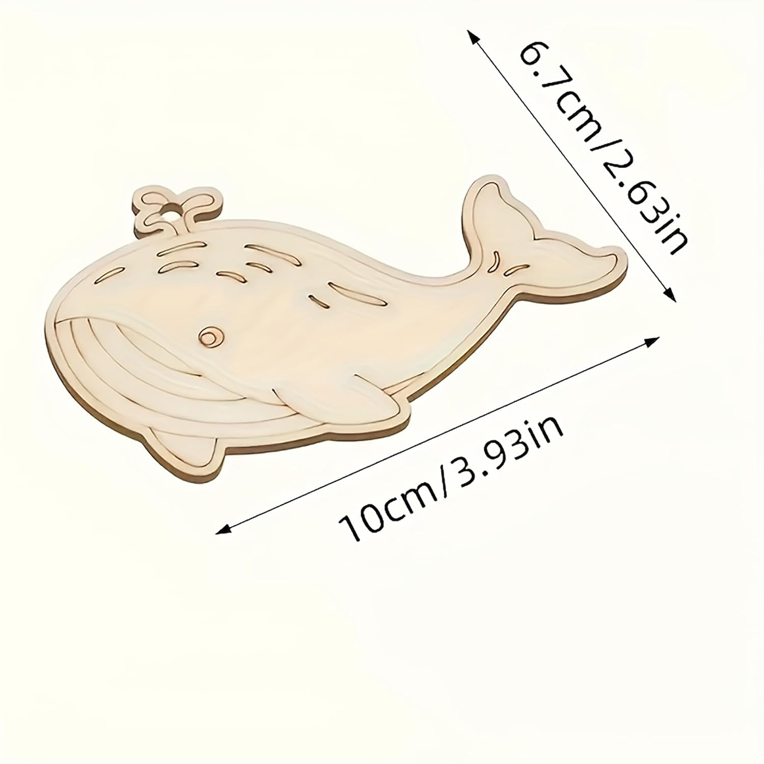 Wooden whale-shaped cutout with measurements on a white background