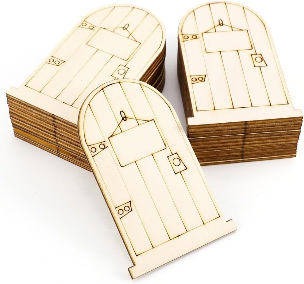Stack of wooden fairy doors on a white background