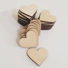 Wooden heart-shaped pieces on a white background