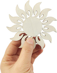 Hand holding a sun-shaped wooden cutout against a white background