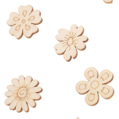 Four wooden flower-shaped cutouts on a white background