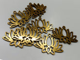 Gold floral-shaped metal decorations on a gray background
