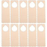 Nine beige fabric strips with scalloped edges on a white background