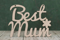 Wooden decorative sign with 'Best Mum' text on a wooden surface and dark background