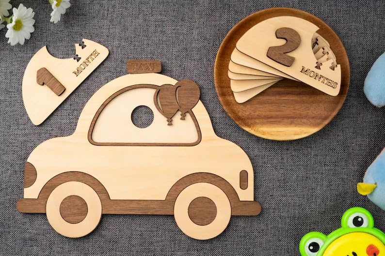 Wooden toy car and number cards on a textured surface with a frog toy in the corner.