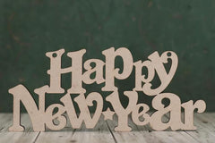 Wooden 'Happy New Year' decoration on a wooden surface with a dark background