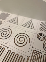 Close-up of geometric patterned tiles on a flat surface