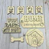 Set of wooden pet-themed signs on a wooden surface