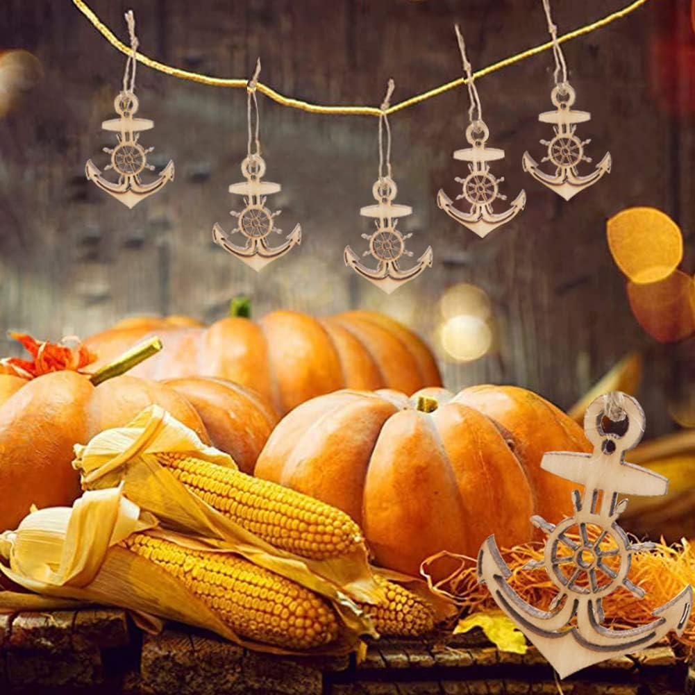 Decorative arrangement with pumpkins, corn, and nautical-themed ornaments on a wooden surface.