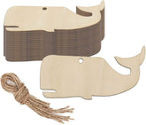 Wooden whale-shaped cutout with a tassel on a white background