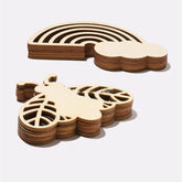 Wooden coasters shaped like a cloud and a leaf on a white background