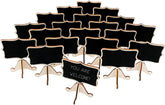 Set of small black chalkboards with stands on a white background