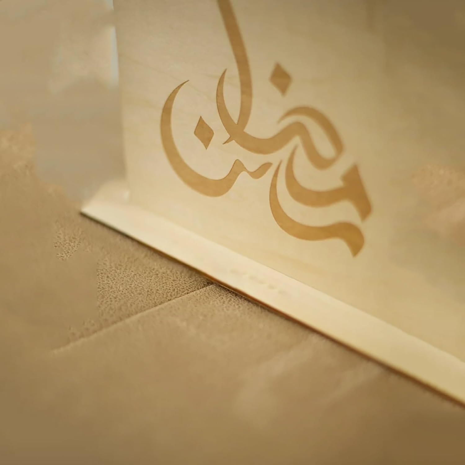 Beige card with Arabic calligraphy on a matching envelope