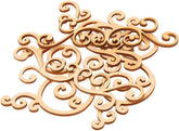 Decorative wooden cutout with intricate scroll design on a white background
