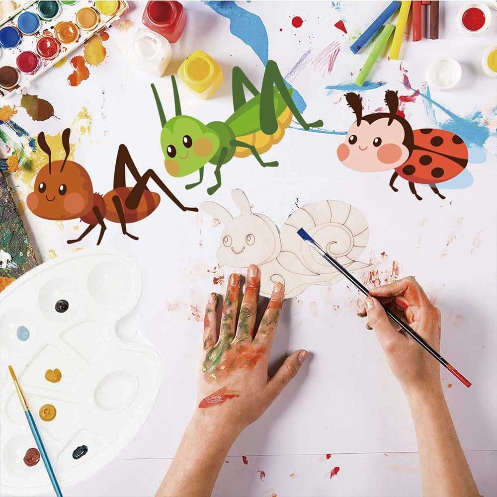 Children's art project with painted insects and a hand holding a paintbrush.