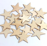 Collection of wooden star shapes on a white background