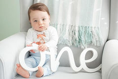 one wooden sign for first birthday