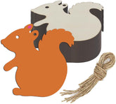 Squirrel-shaped wooden cutout with twine on a white background