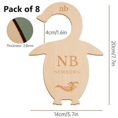 Wooden penguin-shaped baby announcement card with measurements and thickness details on a white background