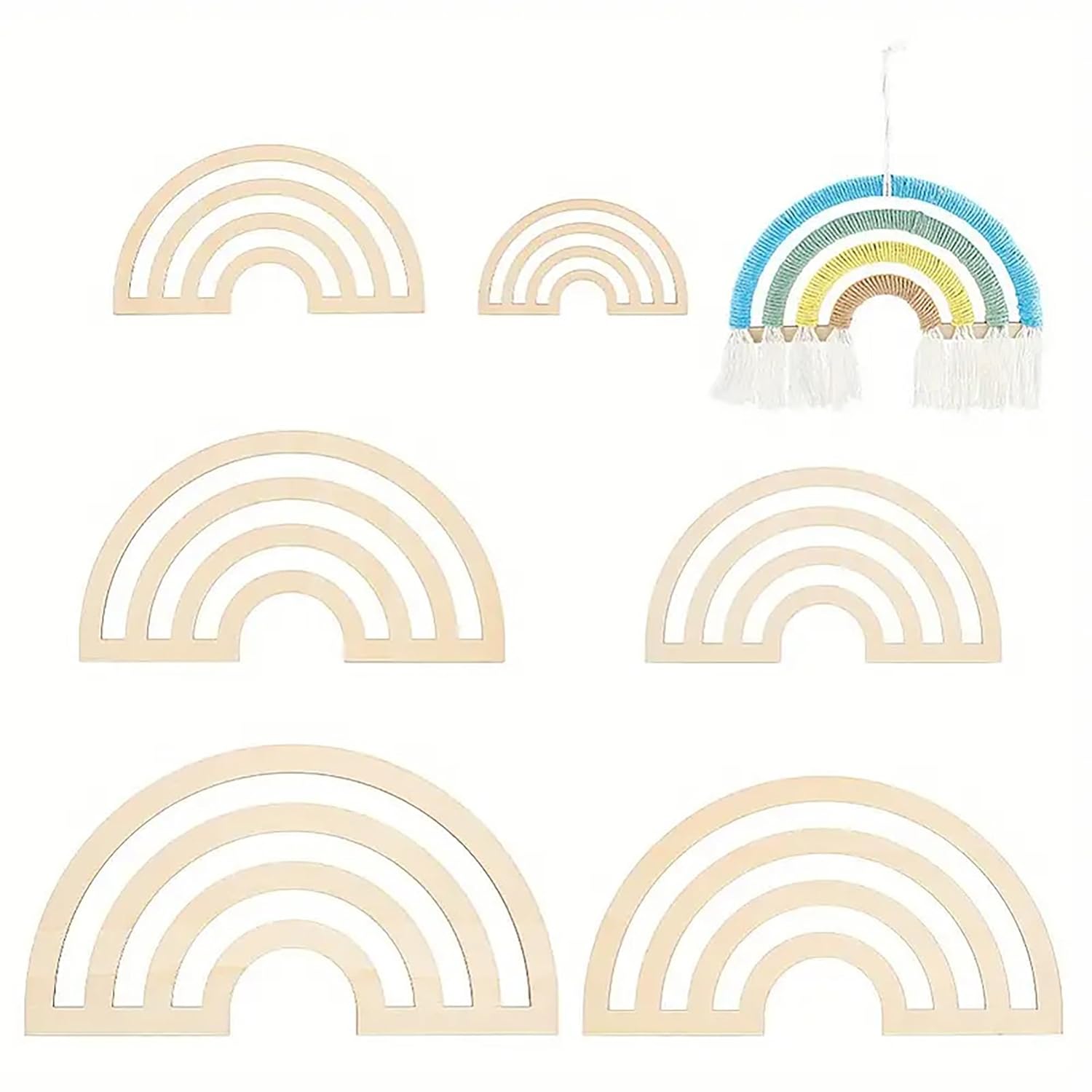 Set of rainbow-shaped hangers with a colorful one on a white background