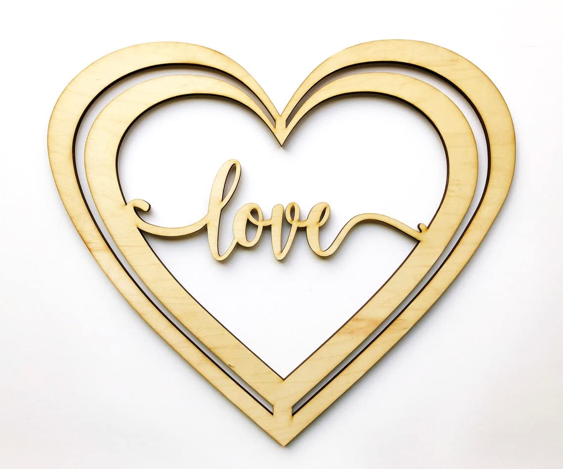 Gold heart-shaped decorative item with 'love' text on a white background