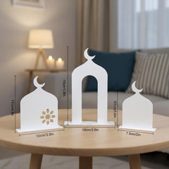 Three white decorative lanterns on a wooden table with measurements, living room background.