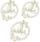 Three 'Eid Mubarak' decorative elements with floral wreaths on a white background