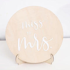 Round beige box with 'Miss to Mrs.' text on a white background