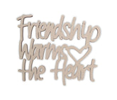 Wooden decorative sign with 'Friendship warms the heart' text on a white background
