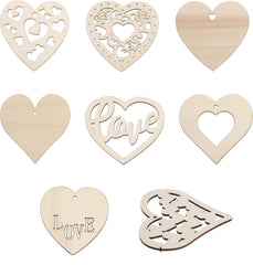 Set of wooden heart-shaped decorations with cut-out designs on a white background