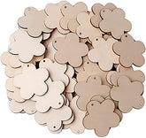 Beige flower-shaped tags with holes on a white background