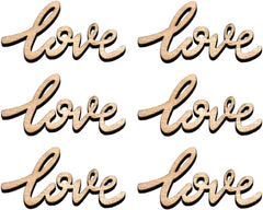 Wooden cutouts of the word 'love' in various styles on a white background