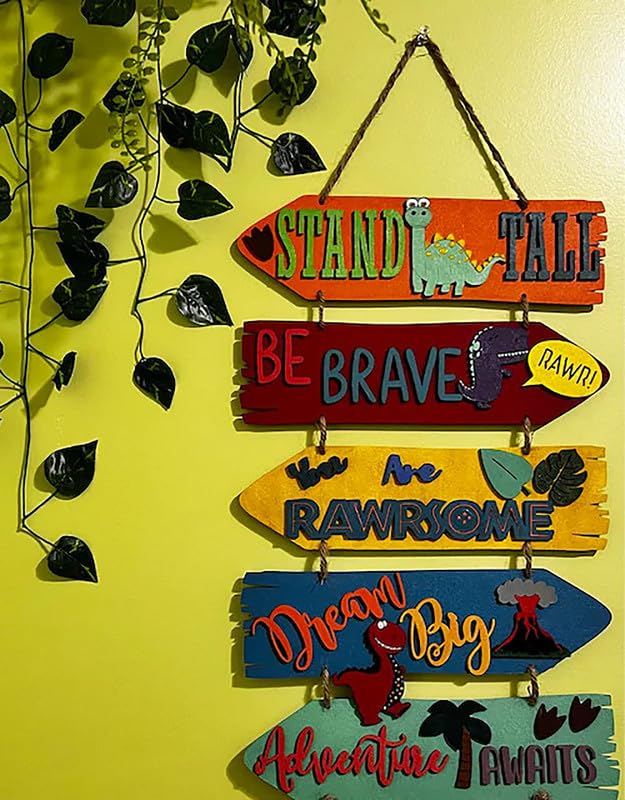 Decorative sign with motivational phrases and dinosaur illustrations on a yellow background.