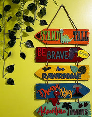 Decorative sign with motivational phrases and dinosaur illustrations on a yellow background.